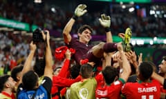 Morocco players lift up their goalkeeper, Yassine Bounou, after beating Spain 3-0 on penalties in the last-16 match at the Qatar World Cup.