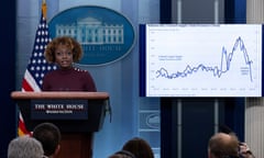 woman at a podium with a chart behind her