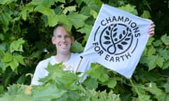 Etienne Stott with a 'Champions For Earth' flag