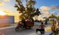 Locals make their way home as the sun sets on Funafuti island in Tuvalu.