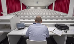 Coronavirus in Switzerland<br>epaselect epa08299023 Lecturer and lawyer Dominik Gasser gives an online lecture in the empty lecture hall of the University of Lucerne, Switzerland, 16 March 2020. Due to the Covid-19 coronavirus, the University of Lucerne was closed on 13 March and the lectures will be transmitted digitally to the students. EPA/URS FLUEELER