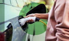 The image shows a woman charging an electric vehicle.