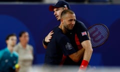 Andy Murray is consoled by his partner, Dan Evans, after defeat in the men’s doubles.