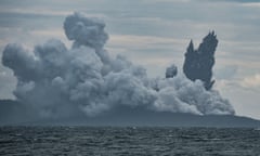 The Anak Krakatau volcano continues to throw out hot ash in a photograph taken from an Indonesian naval patrol boat on 28 December.