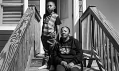 Kimberly White Smalls sits on her front stairs with her grandson Donovan E. Smalls, 9, on Beach 43rd Street in the Edgemere neighborhood of Far Rockaway, Queens on April 6, 2021. Smalls grew up in the neighborhood and had to flee her family home when Hurricane Sandy hit.