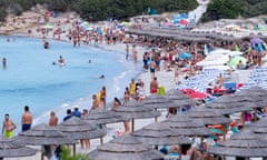 A crowded beach on the Emerald Coast