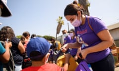 US-HEALTH-VIRUS<br>Nurses and healthcare workers with the Service Employees International Union (SEIU) 121RN distribute backpacks to children during a back to school event offering school supplies, Covid-19 vaccinations, face masks, and other resources for children and their families at the Weingart East Los Angeles YMCA in Los Angeles, California on August 7, 2021. - The restaurant announced that proof of vaccination would be required to dine indoors at the restaurant as Covid-19 variant causes surge in the Los Angeles area. (Photo by Patrick T. FALLON / AFP) (Photo by PATRICK T. FALLON/AFP via Getty Images)