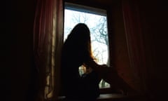 Woman sitting by the window