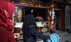 Syrian families outside a Syrian grill shop on Inonu street in Gaziantep, Turkey.