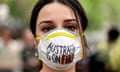 A demonstrator with a mask attends a climate rally in Sydney last Wednesday