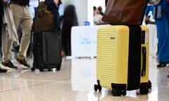 Yellow cabin suitcase at airport