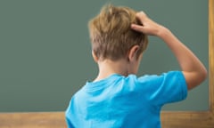 Boy scratching his head (posed by model)