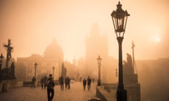 Charles Bridge on a foggy morning in Prague, Czech Republic