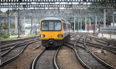 A Northern Rail train made up of ageing Pacer approaches Leeds station.
