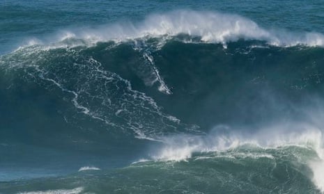 British surfer Tom Butler conquers potential world record '100ft tall wave' – video