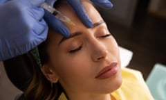 A woman receives a botulinum toxin injection.