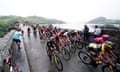 The peloton passes Lake Vyrnwy during stage four between Wrexham and Welshpool.