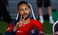 Neymar gestures to fans from the bench during a friendly against Internazionale