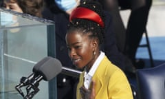 Amanda Gorman wears a red Prada headband and yellow Prada jacket at Joe Biden’s inauguration