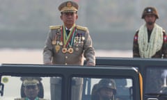 FILE - Senior Gen. Min Aung Hlaing, head of the military council, inspects officers during a parade to commemorate Myanmar's 78th Armed Forces Day in Naypyitaw, Myanmar, on March 27, 2023. When the army moved to overthrow Myanmar's elected government in the early hours of Feb. 1, 2021, to overthrow the elected government of Aung San Suu Kyi, it looked like a walkover that could entrench the military in power indefinitely. Three years later, a poorly armed but popular and politically savvy grassroots resistance movement has shaken the military’s grip, in a modern-day David vs. Goliath scenario, but the costs have been high.(AP Photo/Aung Shine Oo, File)