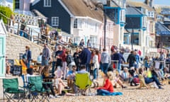 Feasters enjoy the sunshine at the Eat Festival in Lyme Regis.