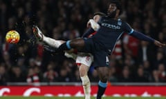 Arsenal's French defender Laurent Koscielny, left, vies with Manchester City's Wilfried Bony