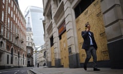 A man walks through a near-deserted City of London