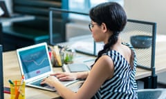 Concentrated longhaired girl sitting at her workplace<br>RPNW6R Concentrated longhaired girl sitting at her workplace