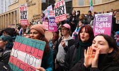 Trans rights campaigners hold placards during a protest in Glasgow in January