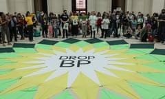 Activists stand around a banner that says 'Drop BP' at the British Museum in April 2022