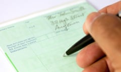 A doctor writing a prescription form for medication on his prescription pad for a patient