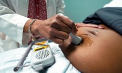 A doctor examines a pregnant woman on 17 December 2021, in Jackson, Mississippi.