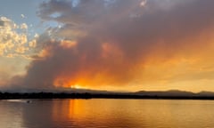 a lake with a fire burning on its shores