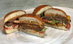 FILE - This Friday, May 3, 2019 file photo shows an Original Impossible Burger, left, and a Cali Burger, from Umami Burger, in New York. A new era of meat alternatives is here, with Beyond Meat becoming the first vegan meat company to go public and Impossible Burger popping up on menus around the country. Several new vegetarian products are competing to win over meat lovers, but two California companies _ Impossible Foods and Beyond Meat _ are grabbing attention for patties that are red before they’re cooked, making them resemble raw beef. (AP Photo/Richard Drew)