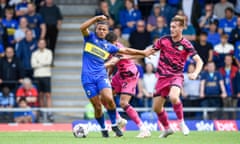 Wimbledon’s Ali Al-Hamadi (left)