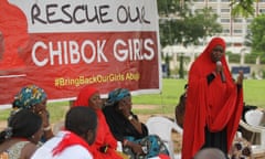 A member of the #BringBackOurGirls Abuja campaign group addresses a protest in Abuja