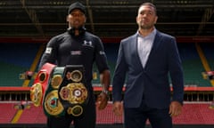 Britain's Anthony Joshua (L) and Bulgaria's Kubrat Pulev (R) stand on the pitch at the Principality Stadium in Cardiff on September 11, 2017 during a promotional event for their heavyweight world title boxing match. Britain's Anthony Joshua will defend his IBO, IBF and WBA world heavyweight titles against Bulgaria's Kubrat Pulev at Cardiff's Principality Stadium on October 28. / AFP PHOTO / Geoff CADDICKGEOFF CADDICK/AFP/Getty Images