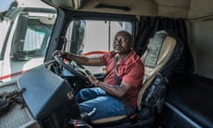 Alphonse Wambua in the cab of a truck.