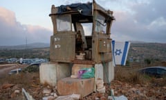 An Israeli soldiers prays in the Eviatar outpost in the Israeli-occupied West Bank