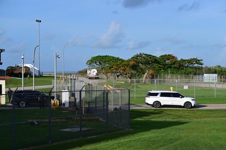 A vehicle believed to be carrying WikiLeaks founder Julian Assange leaves Saipan International Airport in Saipan, Northern Mariana Islands.