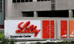An orange-and-white sign for Eli Lilly outside their corporate headquarters in Indianapolis.