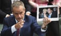 Bill Shorten with a photograph of Chinese billionaire and political donor Huang Xiangmo and Julie Bishop.