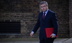 Robert Buckland walking on a street in London