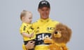 Chris Froome celebrates on the podium with his son Kellan.