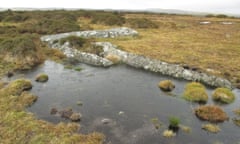 Water pools around remnants of hollowed-out moorstone, Bodwin Moor
