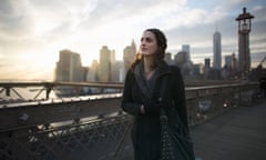 Young woman strolling on Brooklyn bridge