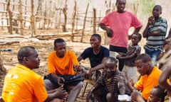 Community health workers visit Sinafala village with boxes of Eurartesim antimalarial tablets.