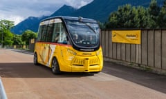 Autonomously driving electric bus NAVYA ARMA in yellow livery operated by Postauto in Switzerland.<br>GF5D07 Autonomously driving electric bus NAVYA ARMA in yellow livery operated by Postauto in Switzerland.