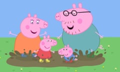 Daddy Pig with Mamma Pig, Peppa and her brother in a puddle on the grass