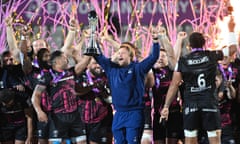 Bristol players celebrate with the trophy.